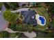 Overhead view of home in well landscaped neighborhood. Backyard features pool and ample green space at 6455 Darely Ct, Cumming, GA 30040