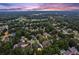 Beautiful aerial view of a residential neighborhood with mature trees and manicured lawns at 6455 Darely Ct, Cumming, GA 30040