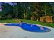 Beautiful backyard featuring a large inground pool, spa, and a pergola at 6455 Darely Ct, Cumming, GA 30040