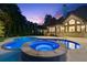 Backyard with a heated pool and spa at 6455 Darely Ct, Cumming, GA 30040