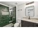 Modern bathroom features a glass-enclosed shower with decorative tile and granite countertops at 6455 Darely Ct, Cumming, GA 30040