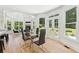 Bright breakfast nook with backyard views and modern decor at 6455 Darely Ct, Cumming, GA 30040