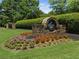 Stone sign and flowers at Polo Golf & Country Club entrance at 6455 Darely Ct, Cumming, GA 30040