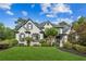 Charming two-story home with a well-manicured lawn and beautiful landscaping at 6455 Darely Ct, Cumming, GA 30040
