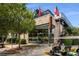 A shot of a commercial building featuring a restaurant with a patio and flags at 6455 Darely Ct, Cumming, GA 30040