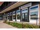 Commercial building featuring black columns, large windows, and clear signage for various advisory services at 6455 Darely Ct, Cumming, GA 30040
