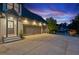 Beautiful home exterior with a three car garage and well manicured yard at 6455 Darely Ct, Cumming, GA 30040