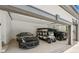 Bright three-car garage featuring epoxy floors and space for a golf cart and a sportscar at 6455 Darely Ct, Cumming, GA 30040