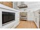 Gourmet kitchen with stainless steel appliances, custom cabinetry, and a built-in microwave at 6455 Darely Ct, Cumming, GA 30040