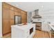 Bright kitchen with stainless steel appliances, hardwood floors, and custom cabinets offers a sleek design at 6455 Darely Ct, Cumming, GA 30040