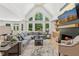 Bright living room features cathedral ceilings, fireplace, and a large window offering plenty of natural light at 6455 Darely Ct, Cumming, GA 30040