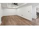 Spacious living room featuring hardwood floors and natural light, perfect for entertaining or relaxing at 6455 Darely Ct, Cumming, GA 30040