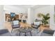 Open concept living room with cozy seating, a fireplace, and seamless flow to the kitchen at 6455 Darely Ct, Cumming, GA 30040