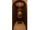 A custom wine cellar with brick accents, herringbone floors, and ample bottle storage at 6455 Darely Ct, Cumming, GA 30040