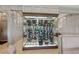Custom wine cellar with glass enclosure, housing many bottles, surrounded by architectural millwork at 6455 Darely Ct, Cumming, GA 30040