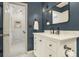 Stylish bathroom with white vanity, marble countertop, and black fixtures at 1101 Collier Nw Rd # K5, Atlanta, GA 30318