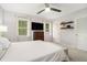 Comfortable bedroom featuring large windows, a ceiling fan, and neutral tones at 1101 Collier Nw Rd # K5, Atlanta, GA 30318