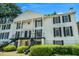 Classic white exterior with black shutters and a grand staircase at 1101 Collier Nw Rd # K5, Atlanta, GA 30318