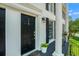 Charming front entrance with a black door, elegant lighting, and a well-manicured garden at 1101 Collier Nw Rd # K5, Atlanta, GA 30318