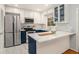 Well-lit kitchen featuring stainless steel appliances, white cabinetry, and subway tile backsplash at 1101 Collier Nw Rd # K5, Atlanta, GA 30318
