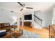Inviting living room featuring a staircase, large-screen TV, and comfortable seating at 1101 Collier Nw Rd # K5, Atlanta, GA 30318