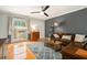 Inviting living room featuring a comfortable leather sofa, stylish rug, and abundant natural light at 1101 Collier Nw Rd # K5, Atlanta, GA 30318