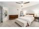 Serene bedroom with neutral colors, carpeted floor, ceiling fan and stylish furniture at 1101 Collier Nw Rd # K5, Atlanta, GA 30318