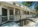 Multi-level patio with screened porch and staircase at 1101 Collier Nw Rd # K5, Atlanta, GA 30318