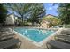 Community swimming pool surrounded by lounge chairs and lush greenery at 1101 Collier Nw Rd # K5, Atlanta, GA 30318
