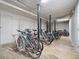 Secured bike storage room with rows of parked bicycles at 1101 Collier Nw Rd # K5, Atlanta, GA 30318