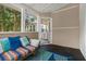 Cozy sunroom with colorful pillows and ample natural light at 1101 Collier Nw Rd # K5, Atlanta, GA 30318