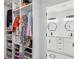 Walk-in closet featuring custom shelving and storage solutions, plus a peek into the bathroom at 1477 Spruce Dr, Smyrna, GA 30080