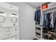 Walk-in closet featuring custom shelving and storage solutions, plus a peek into the bathroom at 1477 Spruce Dr, Smyrna, GA 30080