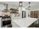 Modern kitchen featuring a spacious island, stainless steel appliances, and stylish white cabinetry at 1477 Spruce Dr, Smyrna, GA 30080