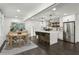 Modern kitchen with a stylish island, stainless steel appliances, and an adjacent dining area at 1477 Spruce Dr, Smyrna, GA 30080
