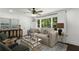 Inviting living room with large windows offering natural light and stylish decor at 1477 Spruce Dr, Smyrna, GA 30080