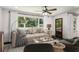 Inviting living room featuring stylish furniture, a ceiling fan, and elegant decor at 1477 Spruce Dr, Smyrna, GA 30080