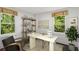 Bright office space with a neutral palette, two windows, modern décor, and comfortable seating at 1477 Spruce Dr, Smyrna, GA 30080
