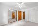 Bedroom featuring neutral walls, carpet, ceiling fan, and view into adjacent rooms at 786 Mitsy Pt, Marietta, GA 30068