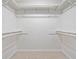 Walk-in closet with white shelving and rods offering ample storage space for clothes and accessories at 786 Mitsy Pt, Marietta, GA 30068