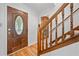 Inviting foyer with wood floors, a decorative front door, and a staircase at 786 Mitsy Pt, Marietta, GA 30068