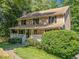 Charming brick home featuring a covered front porch and well-manicured landscaping at 786 Mitsy Pt, Marietta, GA 30068