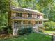 Classic brick home featuring a covered front porch and traditional design at 786 Mitsy Pt, Marietta, GA 30068