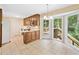 Cozy kitchen with wood cabinets, neutral countertop, and access to deck at 786 Mitsy Pt, Marietta, GA 30068