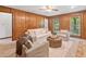 Bright living room showcasing wood paneling, comfortable seating, and views of the outside scenery at 786 Mitsy Pt, Marietta, GA 30068