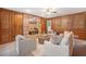 Cozy living room with wood paneling, a brick fireplace, and comfortable seating arrangement at 786 Mitsy Pt, Marietta, GA 30068
