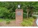 Brick sign for Mitsy Forest neighborhood with lush green landscaping at 786 Mitsy Pt, Marietta, GA 30068