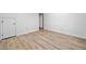 Room with new wood flooring and a white door at 786 Mitsy Pt, Marietta, GA 30068