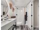 Modern bathroom featuring a stylish vanity, toilet, and tiled shower area at 9025 Huntwood Ln, Riverdale, GA 30274