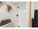 Shower stall featuring white tiles and modern fixtures, accented with a decorative shower curtain at 9025 Huntwood Ln, Riverdale, GA 30274